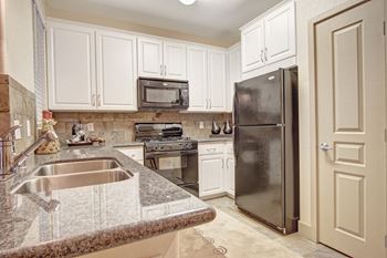 Gorgeous kitchen with custom cabinets and granite countertops